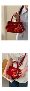 Stylish red crossbody bag with horse charm, minimalist tote design for women daily fashion wear.
