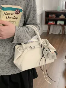 Chic minimalist white women handbag stylish shoulder tote bag with cute charm daily commute.