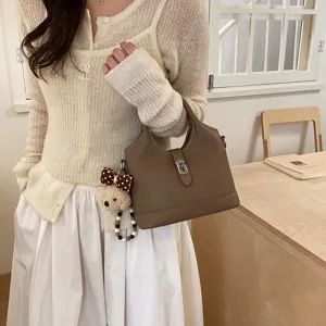 Korean style elegant bucket handbag for women, premium leather single shoulder commuting bag.