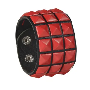 Punk style wide leather cuff bracelet featuring striking red square pyramid studs and buttons.