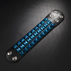 Black PU leather wide cuff bracelet featuring three rows of blue square pyramid spikes and metal snaps.