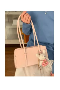 Minimalist pink shoulder bag with cute bear pendant, stylish casual daily handbag for women.