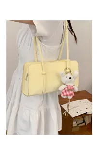 Minimalist yellow underarm shoulder bag for women, chic trendy baguette handbag accessory.