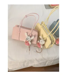 Chic minimalist underarm shoulder bag for women, trendy solid color casual handbag with cute charm.