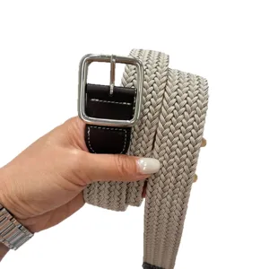 Casual woven stretch belt with leather ends and metal pin buckle for everyday wear.