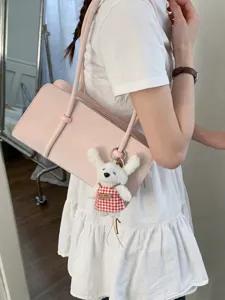 Minimalist pink shoulder bag for women with cute bunny pendant stylish underarm handbag