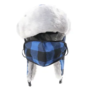 Detail view of the winter plaid bomber hat with detachable face mask and plush ear flaps.