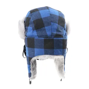 Detail shot of the blue and black plaid winter trapper hat with fluffy faux fur earflaps.