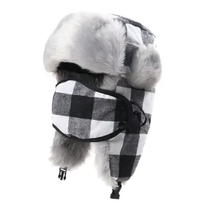 Detailed view of the black and white plaid bomber hat, featuring plush lining and face mask.
