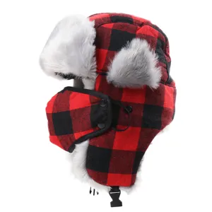 Red and black plaid trapper hat with fleece lining, warm winter snow cap with face mask.