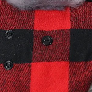 Close-up detail of red black buffalo plaid winter fabric with faux fur trim and buttons.