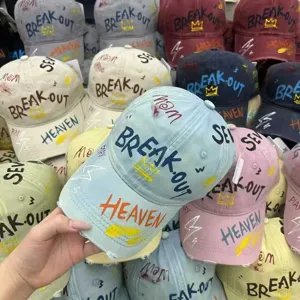 Graffiti letter print detail view of the casual fashion baseball cap, trendy streetwear style.