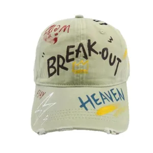 Trendy graffiti baseball cap for women and men, stylish washed cotton dad hat with letters.