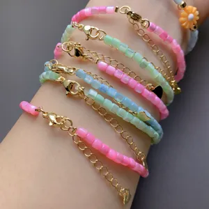 Colorful beaded bracelets stack set with gold chains and sweet daisy charm for women.