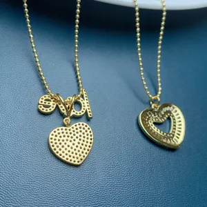 Gold beaded chain necklaces feature pavé zircon heart pendants and unique letter designs.
