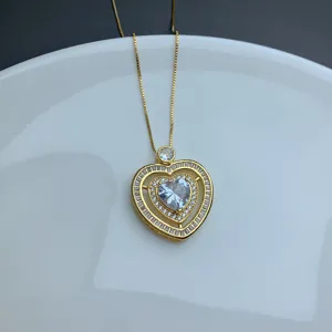 Gold micro-pave rhinestone double heart pendant necklace, elegant chic clavicle jewelry.