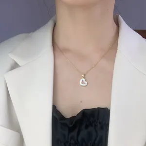 Minimalist white mother-of-pearl heart pendant necklace for women, elegant clavicle chain.