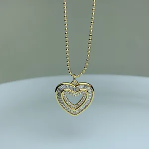 Gold-plated double heart pendant necklace detail, sparkling cubic zirconia stone accents.