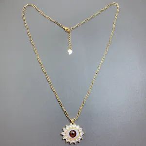Gold paperclip chain necklace with sparkling zircon evil eye pendant for women trendy jewelry.