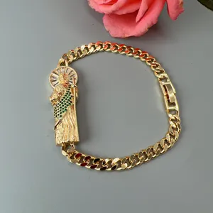 Gold-tone Cuban link bracelet featuring a detailed saint pendant with cubic zirconia.