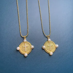 Exquisite cross pendant necklace featuring sparkling rhinestones and elegant pearls for women chic style.