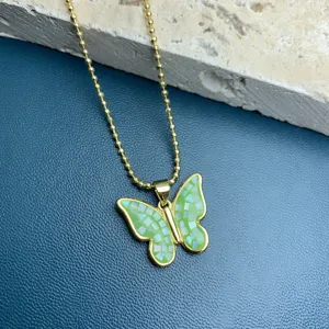 Green mosaic butterfly pendant necklace detail view, elegant gold ball chain accessory.