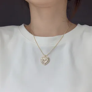 Exquisite gold-plated beaded necklace featuring a sparkling double heart zircon pendant detail.