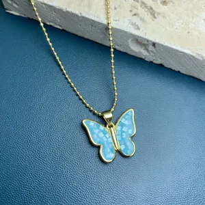 Gold-tone beaded chain necklace featuring a stunning blue shell mosaic butterfly pendant for women.