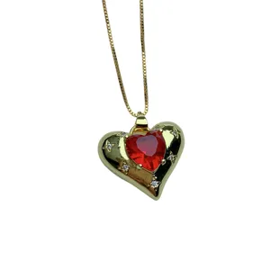Fashion gold-plated heart pendant necklace featuring red crystal and sparkling micro-pave rhinestones.