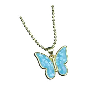 Gold bead chain necklace featuring a light blue mosaic shell butterfly pendant, chic clavicle style.