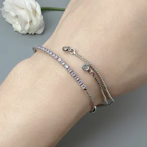Close-up detail view of a gorgeous double-strand crystal zircon bracelet worn on the wrist.