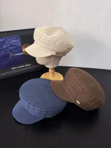 Women's retro knit bakerboy hat with metal badge, breathable spring summer flat top cap.