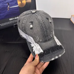 Distressed washed grey baseball cap with embroidered angel wings and stylish front text embroidery.