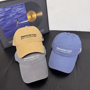 Detailed view of embroidered casual baseball caps in multiple colors, soft top and wide brim style.