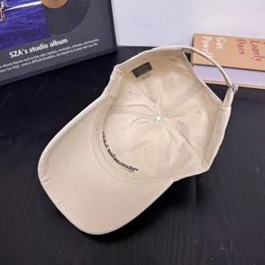 Beige cotton baseball cap, soft top dad hat with inner embroidery details for women daily wear.
