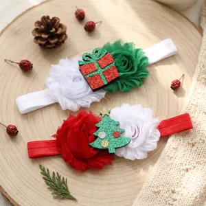 Christmas kids headband detail featuring festive gift and tree designs with soft fabric flowers.