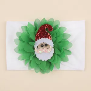Christmas baby hairband detail, soft nylon band with green flower and cute Santa Claus patch.