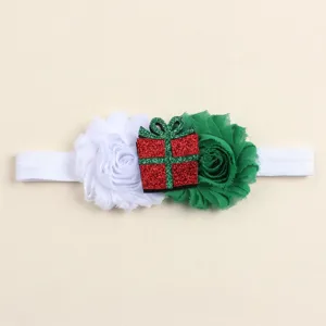 Christmas baby headband detail, white and green fabric flowers with sparkling gift box decor.