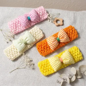 Cute summer baby headband set with checkered bow, soft hollow knit infant hair band styling.