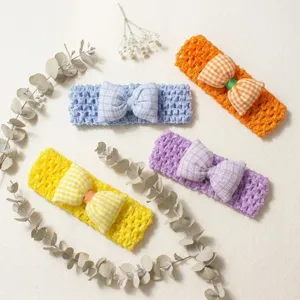 Detailed view of handmade crochet baby headbands with cute checkered bows in vibrant multi colors.