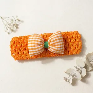 Cute orange crochet baby headband with checkered bow, soft hollow design for babies.
