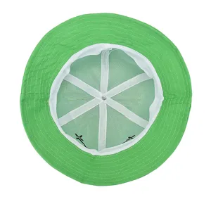 Green bucket hat interior view showing white lining details and comfortable cotton fabric design.