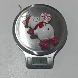 Christmas glitter snowman hanging ornament detail view showing weight for holiday decor.