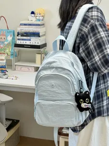 Japanese minimalist casual small backpack for women, light blue crinkled nylon daily daypack.