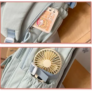 Mochila escolar azul claro estilo coreano con múltiples bolsillos y bonito colgante de oso
