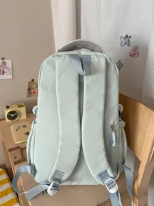 Mochila escolar de estilo coreano azul claro con múltiples bolsillos para estudiantes.