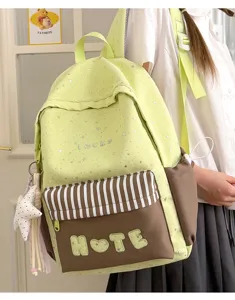 Zaino scolastico verde chiaro con stampa di stelle e tasca marrone per studenti.