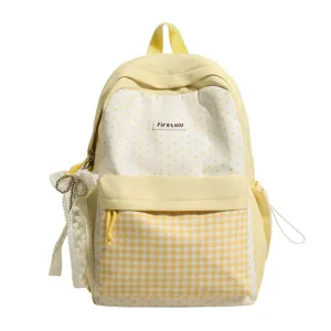 Yellow polka dot sweet Japanese style backpack with lace ribbon pendant for cute girls.