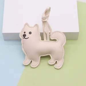 Mignon porte-clés chien en cuir, adorable pendentif de sac chiot rembourré pour les femmes.