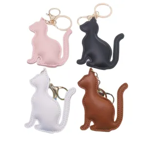 Cute cat shape PU leather keychain for women and girls, minimalist bag charm pendant gift.